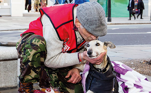 Big Issue vendor Viorel Parnica and his pet dog, Vio