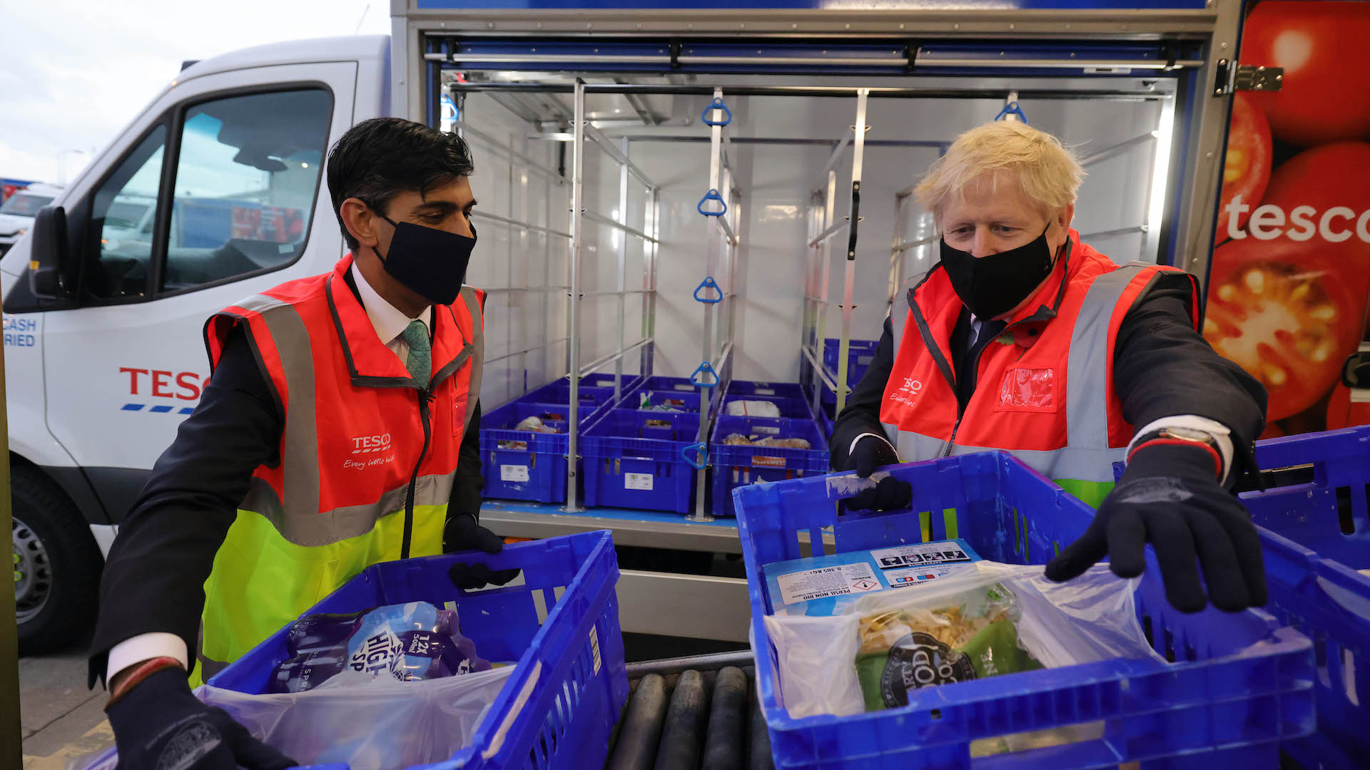 Boris Johnson and Rishi Sunak unload crates at Tesco