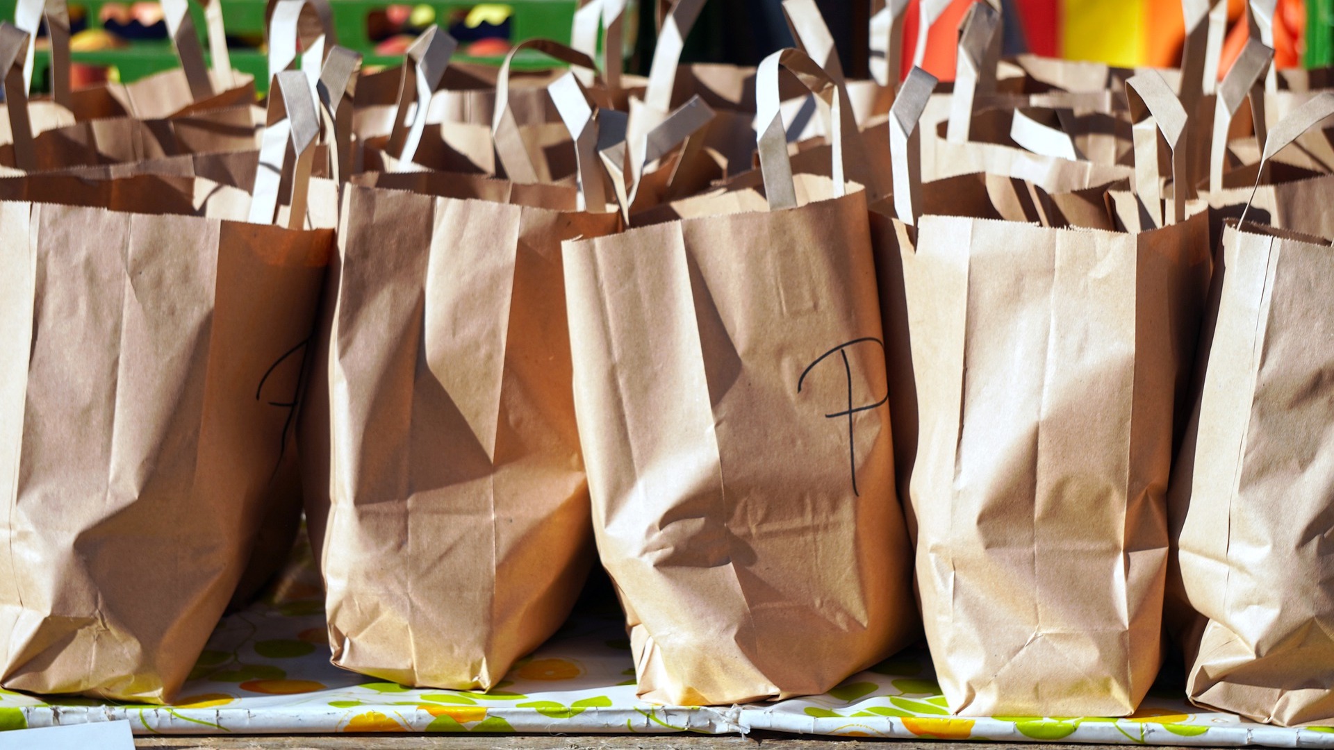 Brown paper bags lined up. The Government has refused to extend free school meals into half term