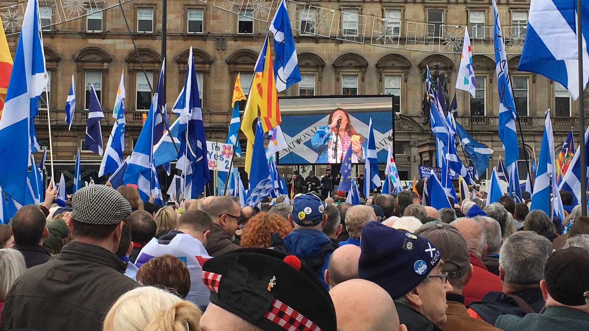Scottish flags and crowds at a Scottish independence rally in george Square, Glasgow, in 2019