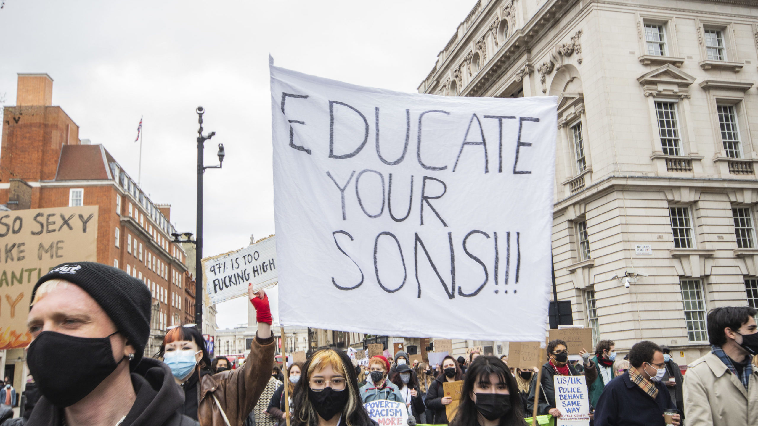 A banner at London's “97% March” in April 2021 reads 'educate your sons'.