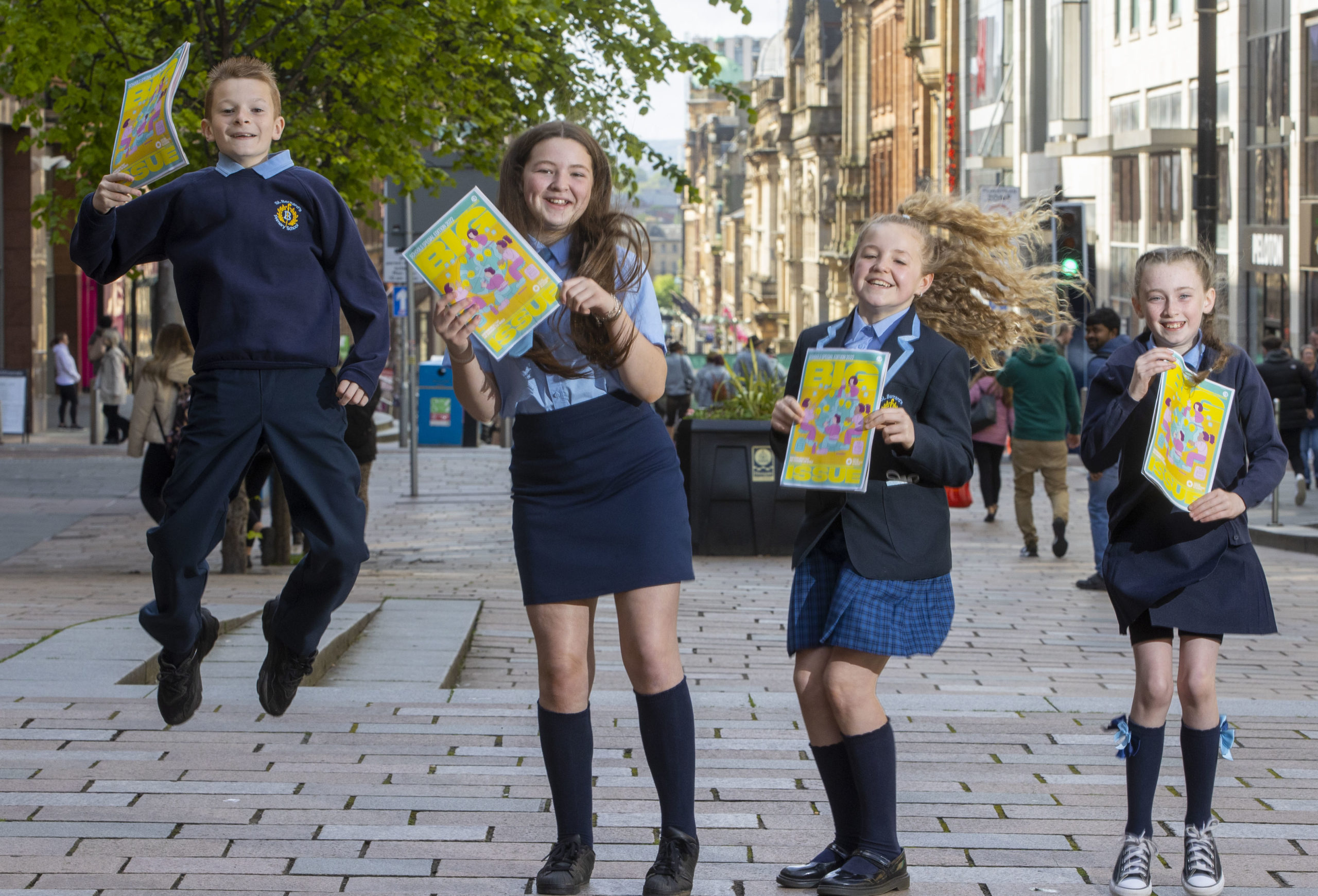 Aaron McKenna, Orla Maxwell, Willow Michael and Kierson Gibb, pupils from St Bernard’s Primary School in Glasgow, celebrate the special edition of The Big Issue, produced in partnership with Social Enterprise Academy. Photo: Jeff Holmes