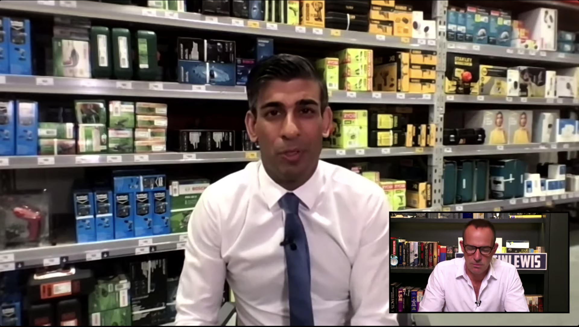 A screenshot from a livestream video shows Rishi Sunak sitting in a warehouse with Martin Lewis in an onset picture