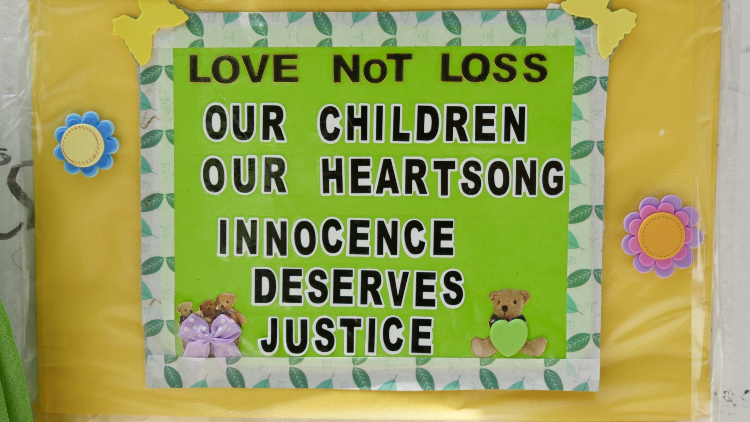 "Innocence deserves justice," this sign acknowledges the 18 children who lost their lives in the grenfell tower fire and calls for action. 