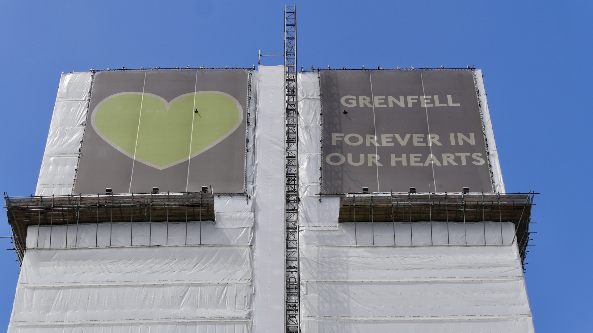 A sign saying "Grenfell forever in our hearts"