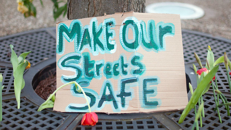 A sign reading "make our streets safe"