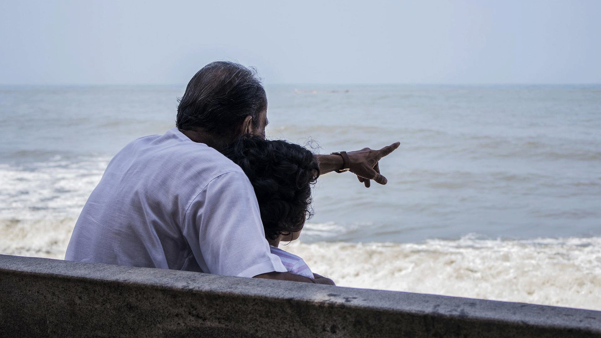 Grandparent and grandchild at the seaside