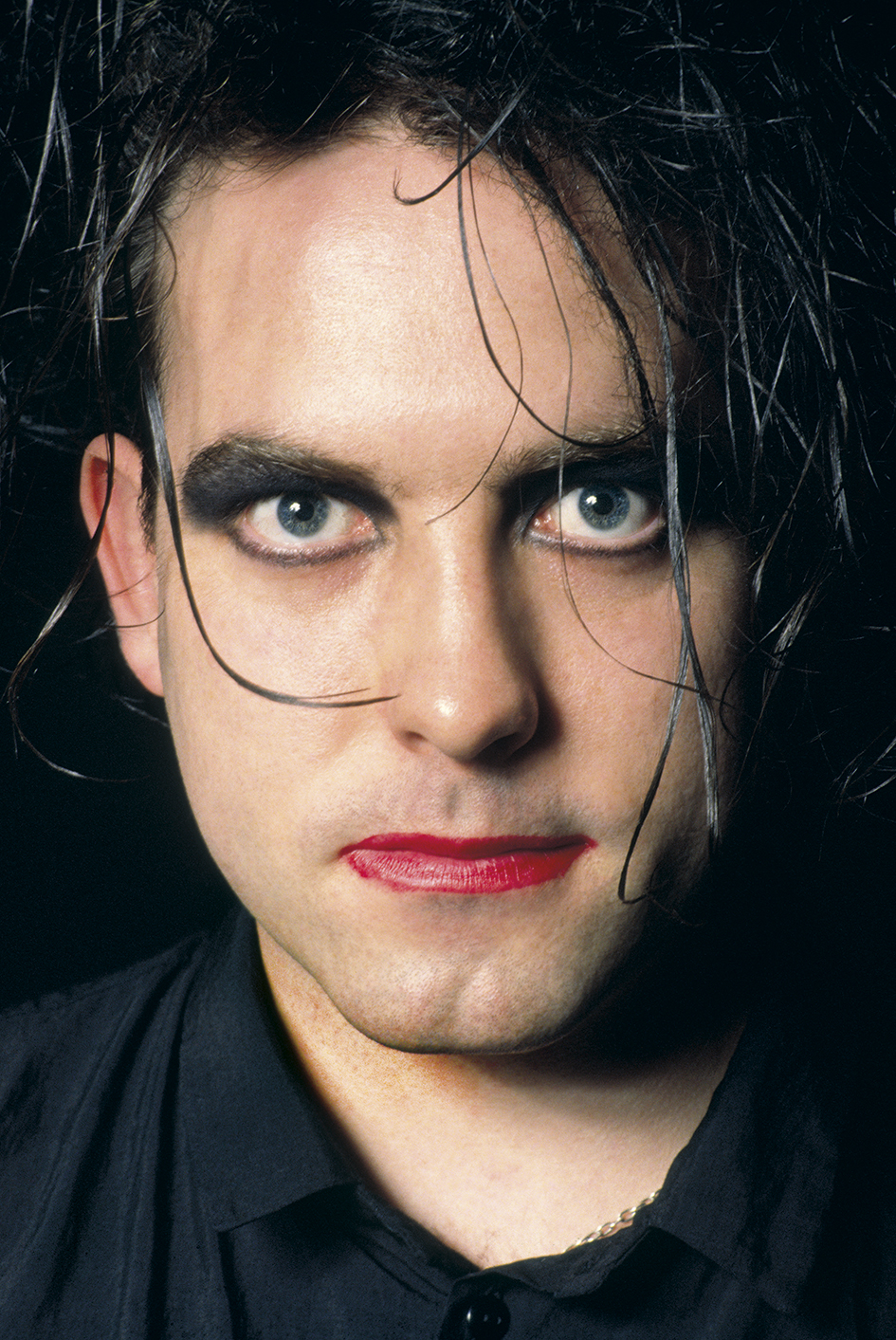 Robert Smith of The Cure looks directly at the camera