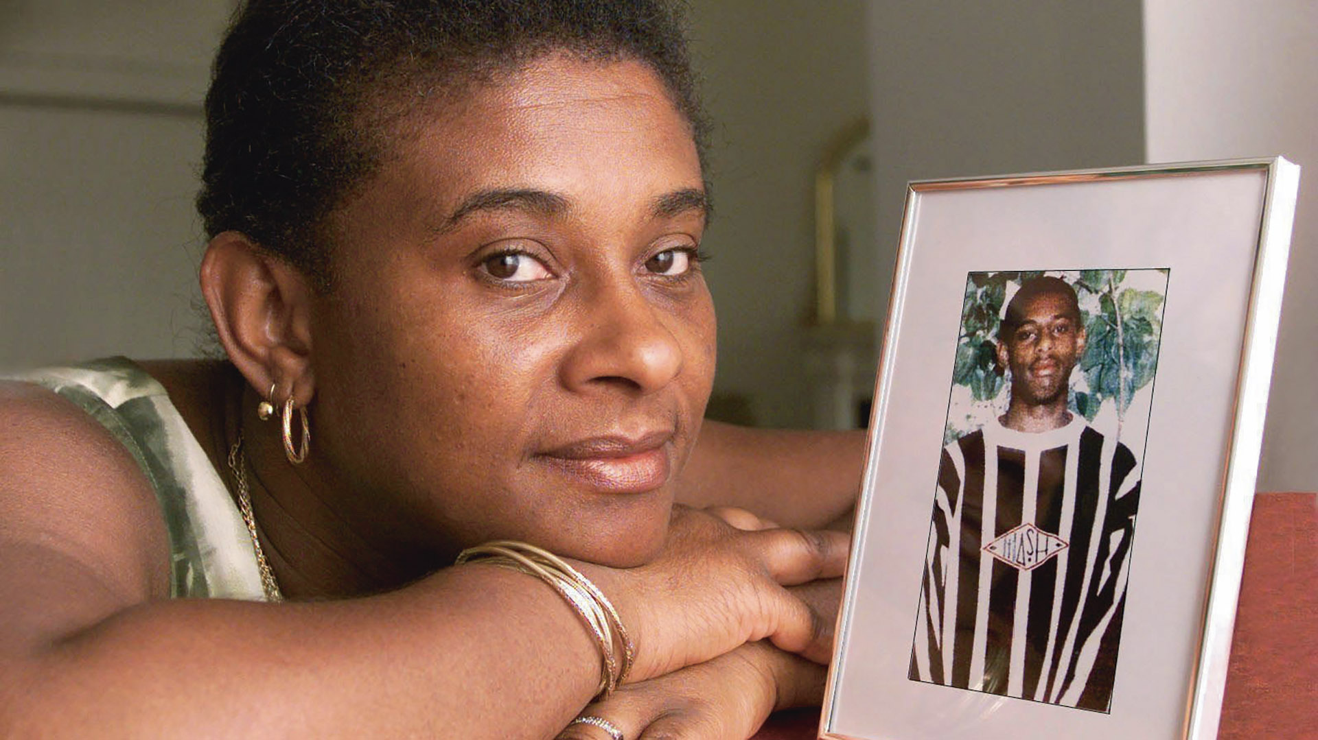 Doreen Lawrence 1999 with a photograph of her late son, Stephen