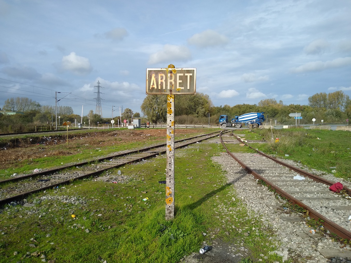 The refugee camp in Grande-Synthe lies next to a railway junction. Photo: Steven MacKenzie
