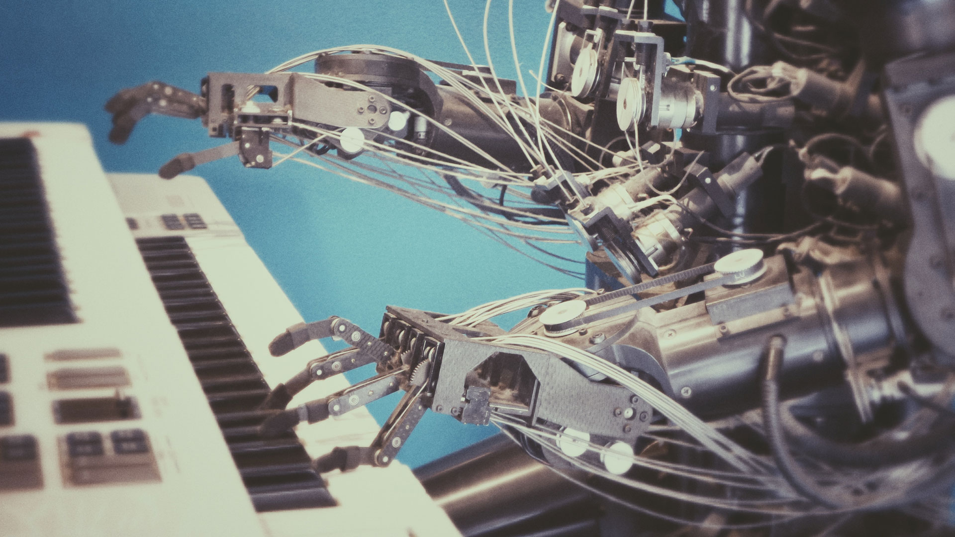 Artificial intelligence: a robot playing a keyboard