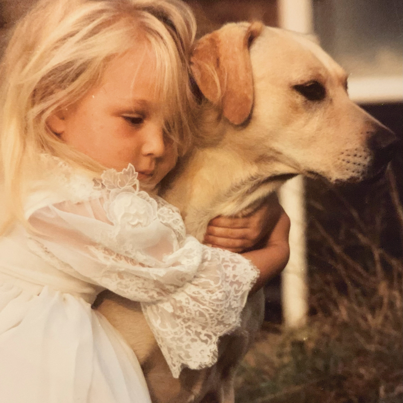 Sophie L Morgan as a child With her yellow labrador Sumo