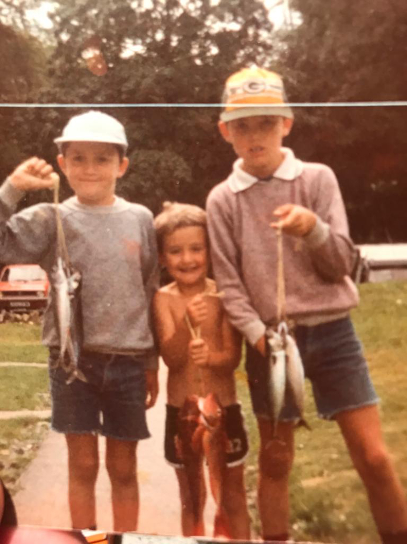 older brother Jonny, Daniel, and eldest brother Paul in the fishing photo taken by their dad