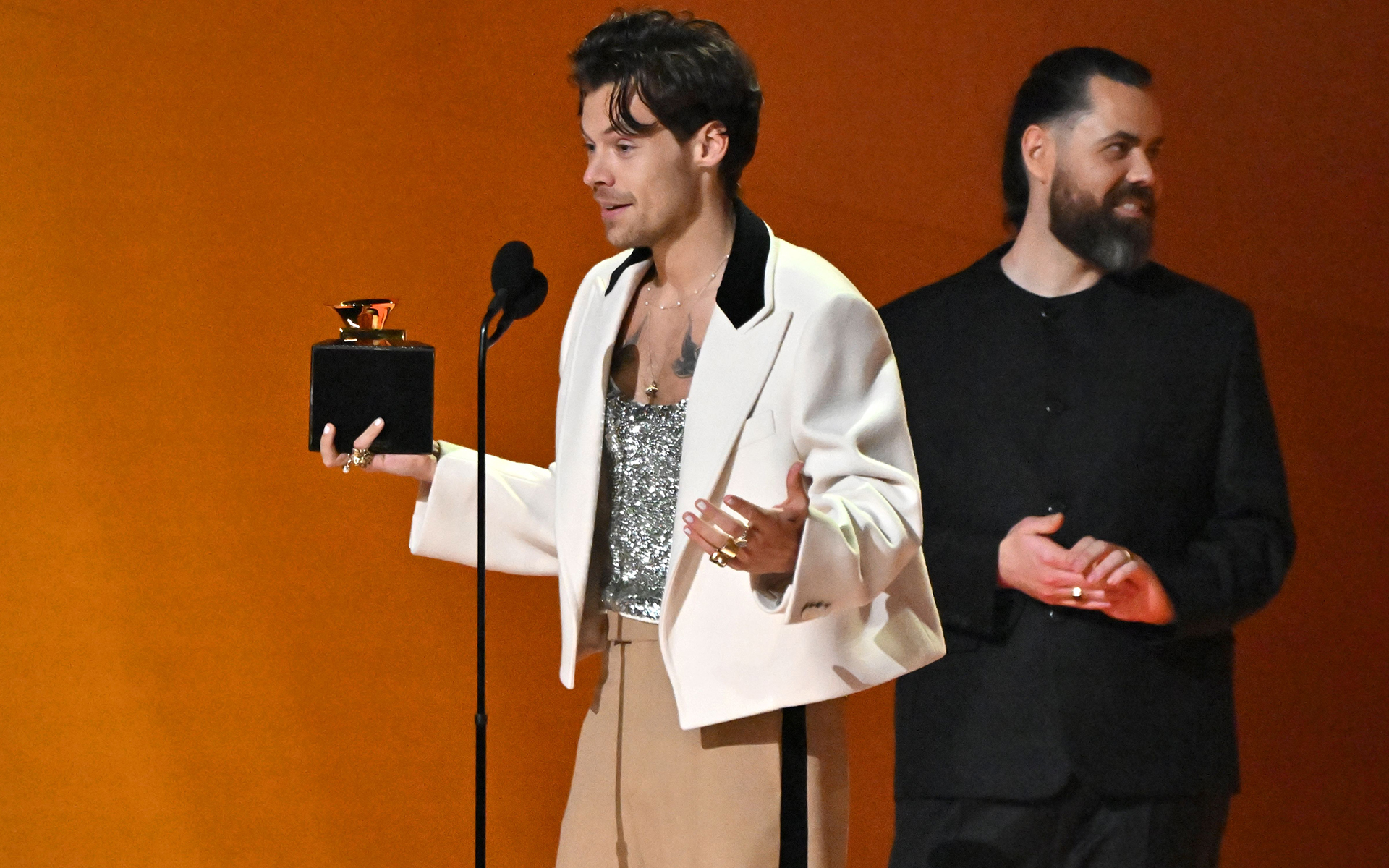 Harry Styles collects the award for Album of the Year at the Grammys 2023. Photo by Rob Latour/ Shutterstock