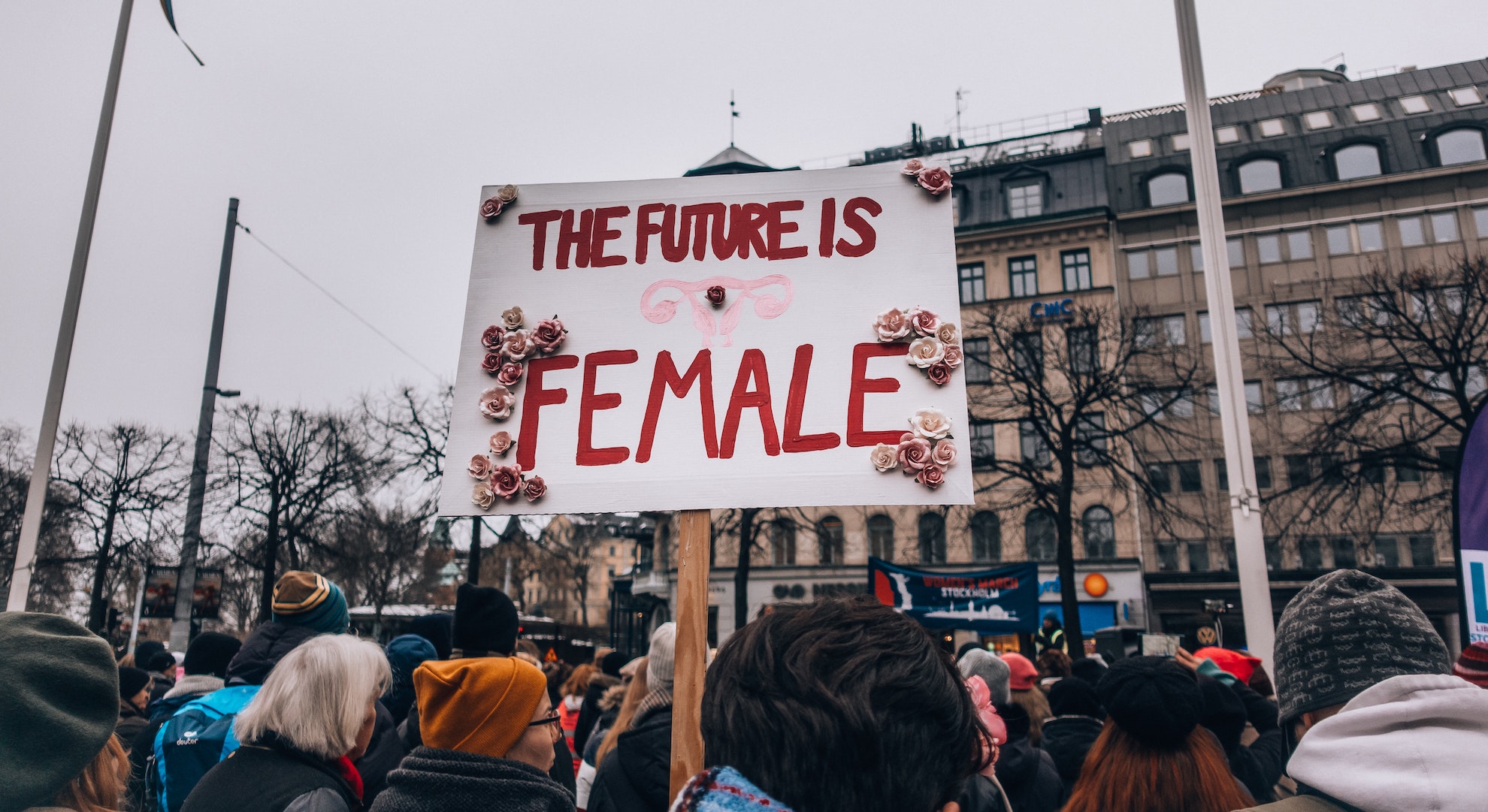 Women's march in Sweden with protest sign that says The Future is Female, a primary message for equality during International Women's Day.