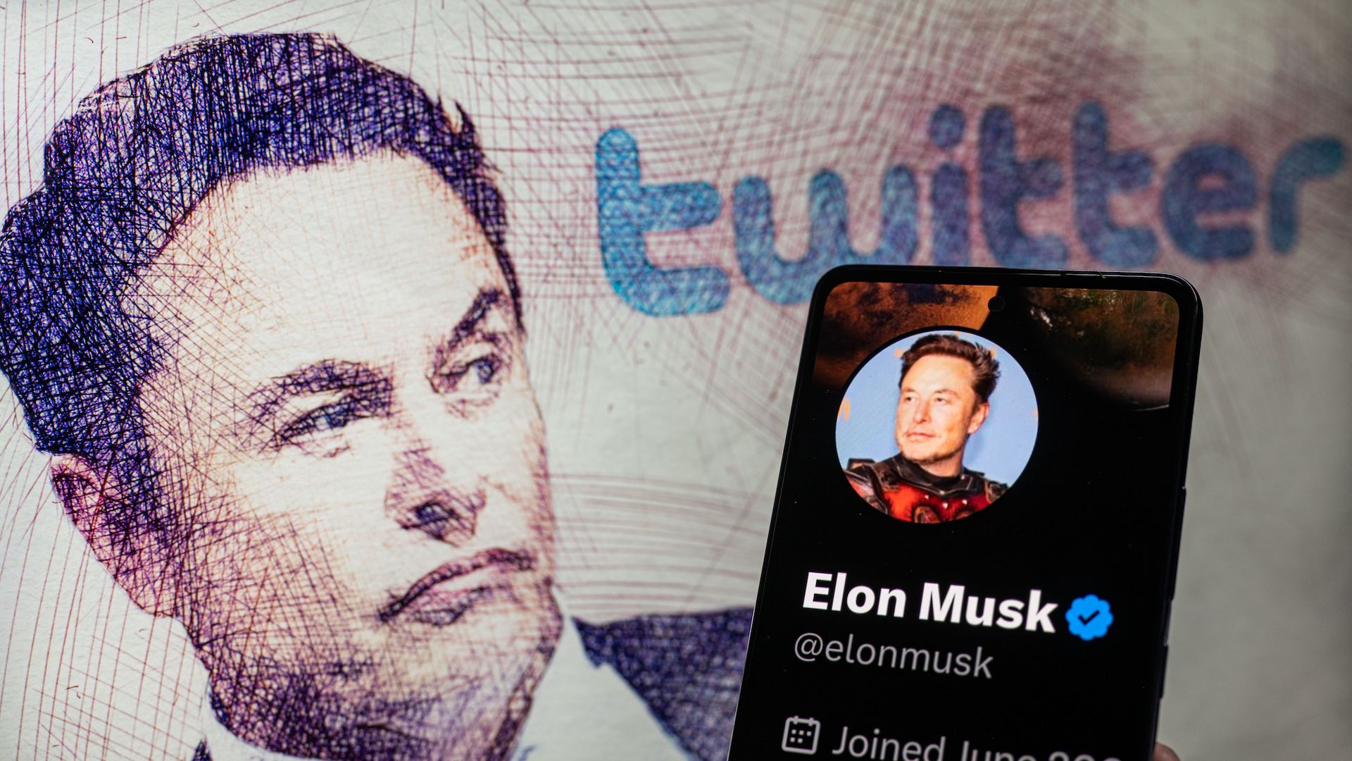 Elon Musk Twitter account seen on Mobile with Elon Musk in the background on screen, seen in this photo illustration.