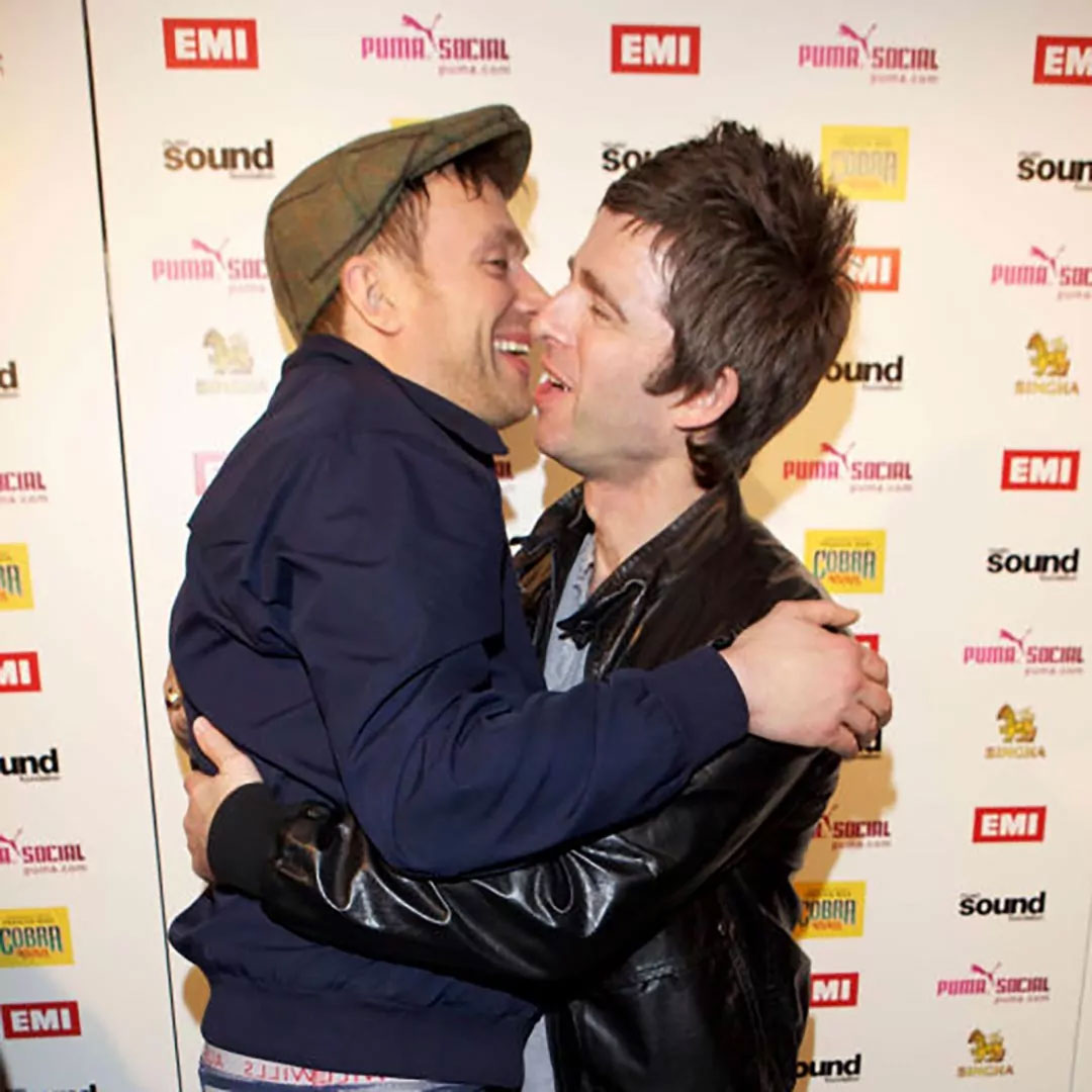 Noel Gallagher embracing nemesis-turned-pal Damon Albarn of Blur and Gorillaz. Image: Dave M. Benett/Getty Images