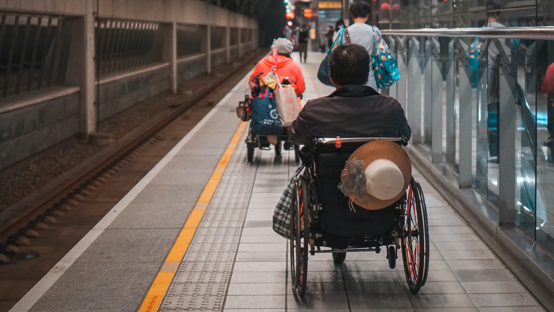 two wheelchair users on a subway platform in Taiwan