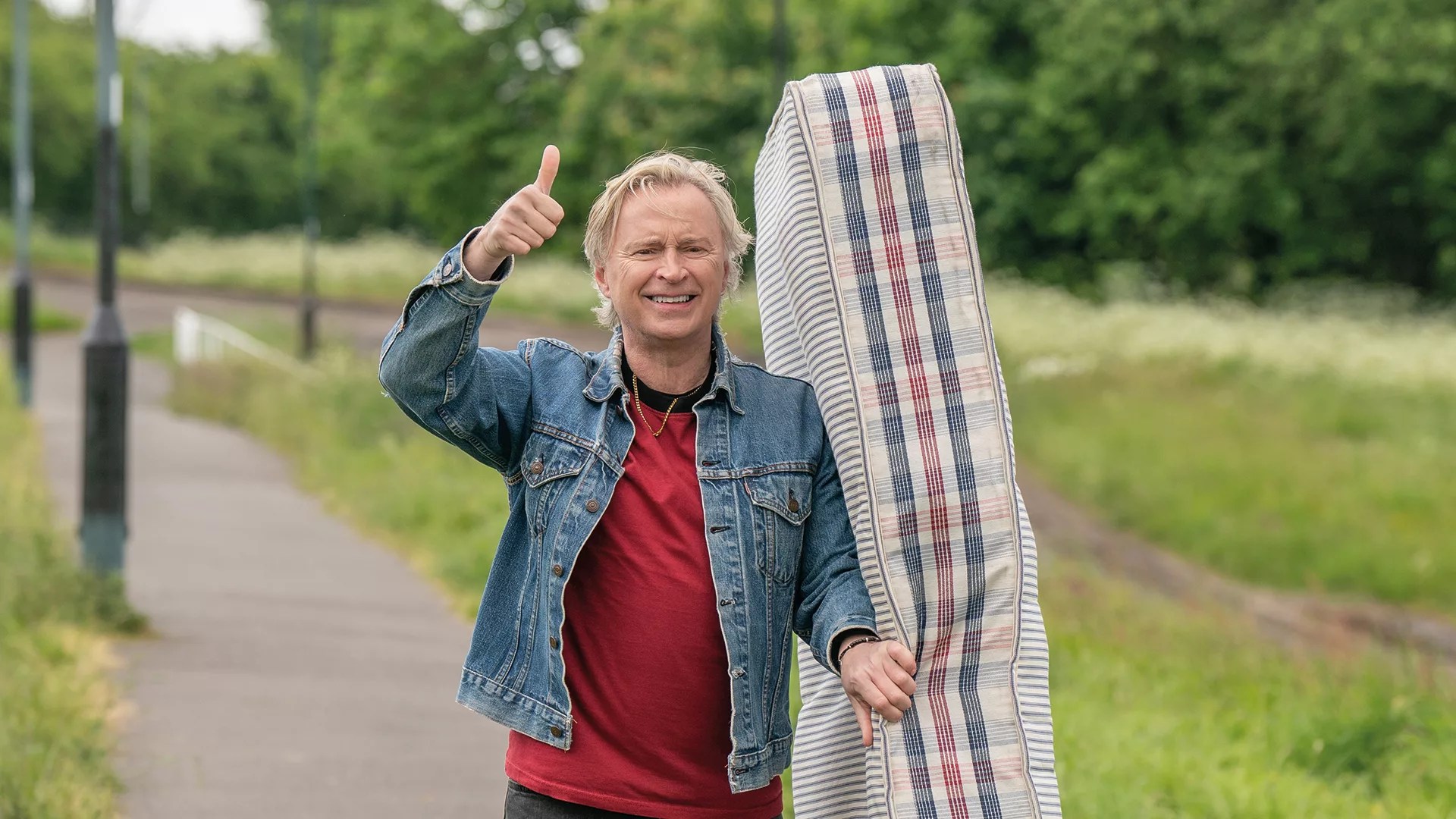 Robert Carlyle as Gaz in The Full Monty carrying a mattress