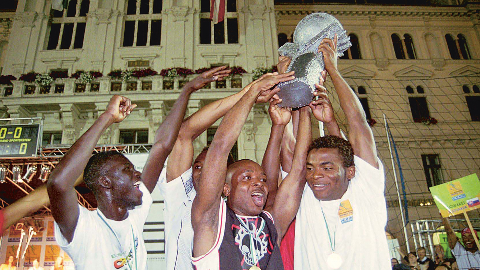 Players celebrate with a trophy