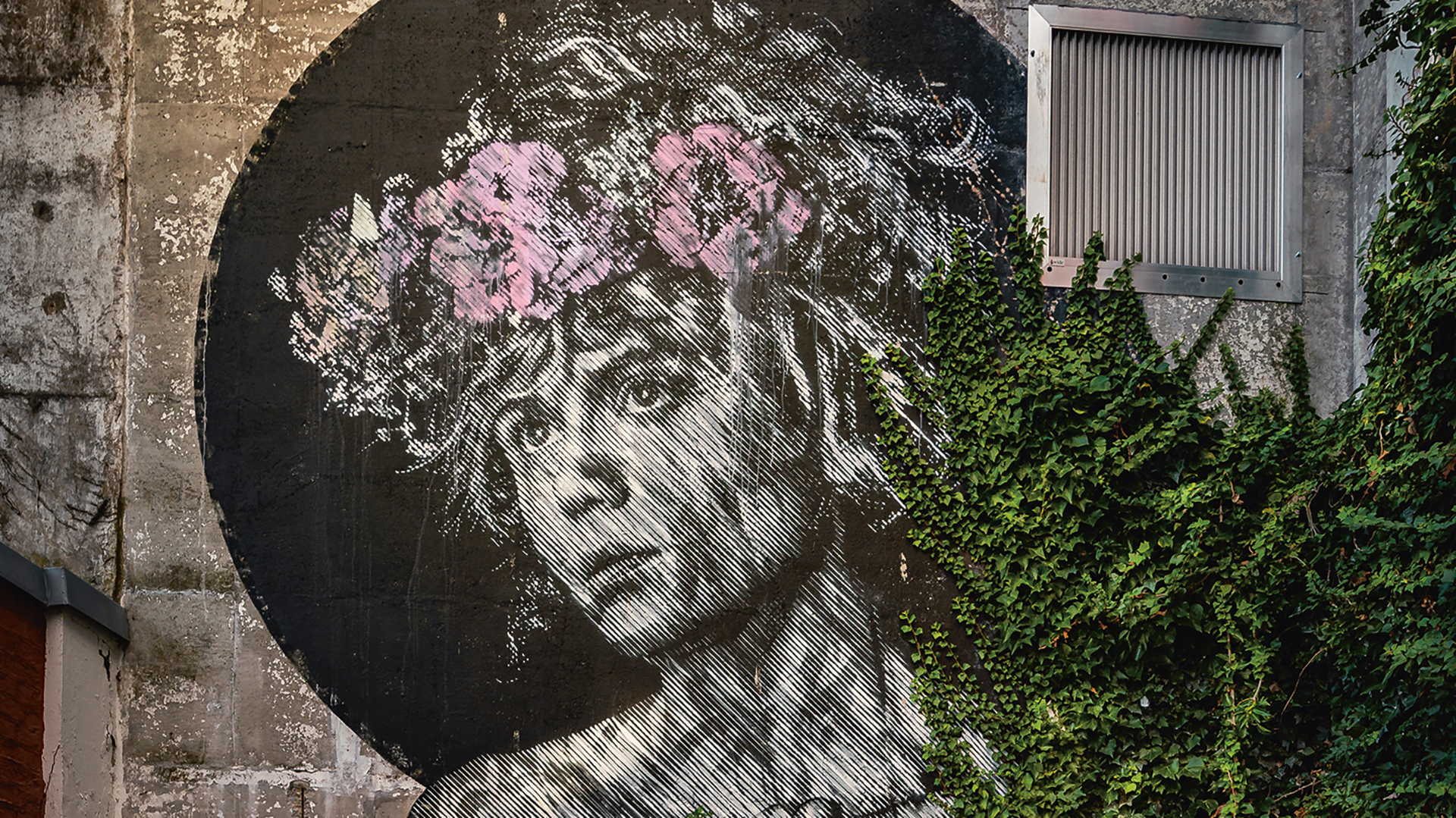 A painting of a girl with flowers for her hair by Artist duo Snik