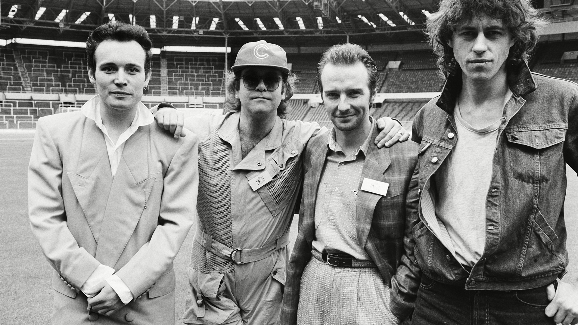 Midge Ure at a Live Aid press conference at Wembley Stadium with Adam Ant, Elton John and Bob Geldof