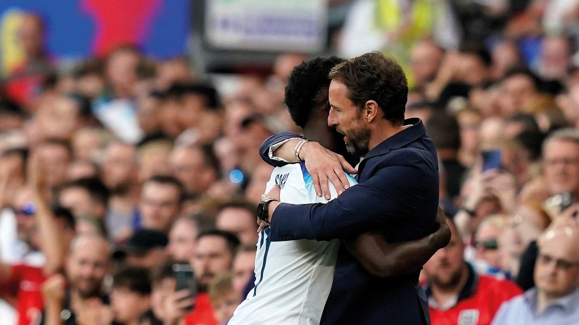Buyako Saka embracing England
manager Gareth
Southgate