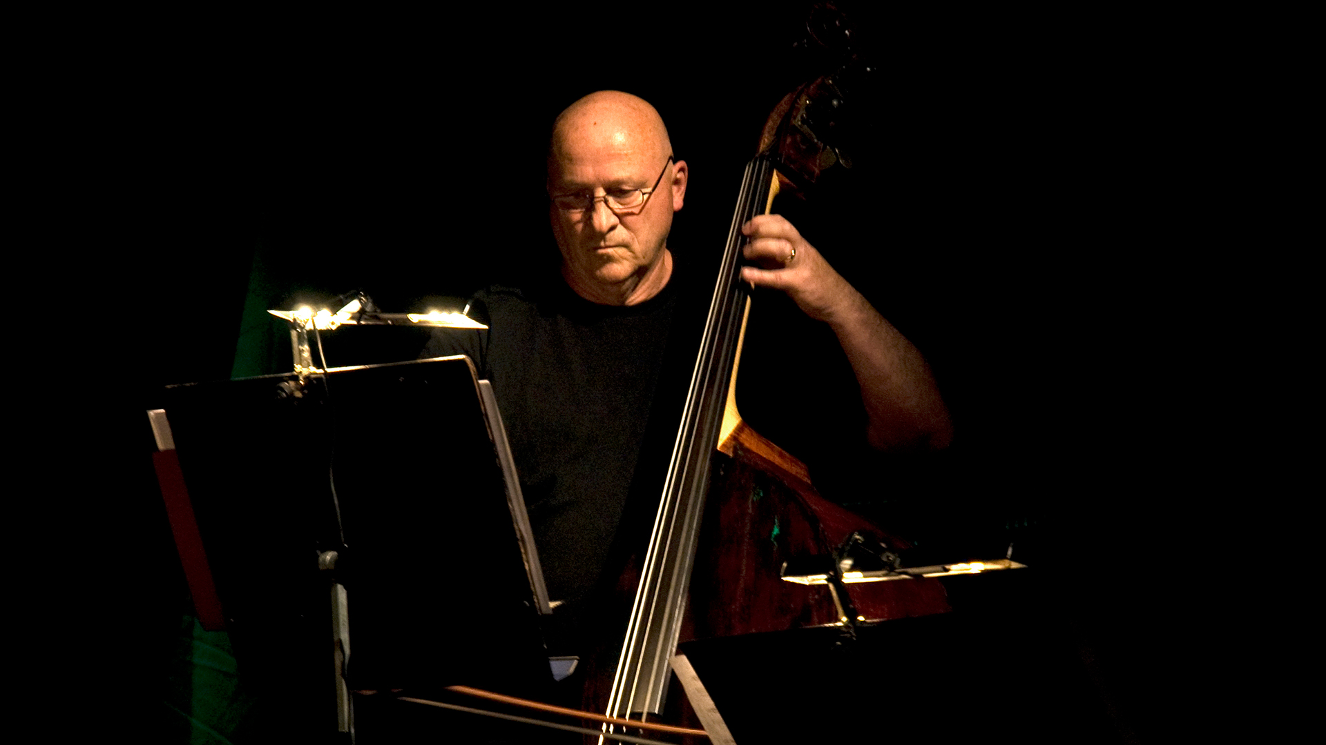 A man playing a double bass
