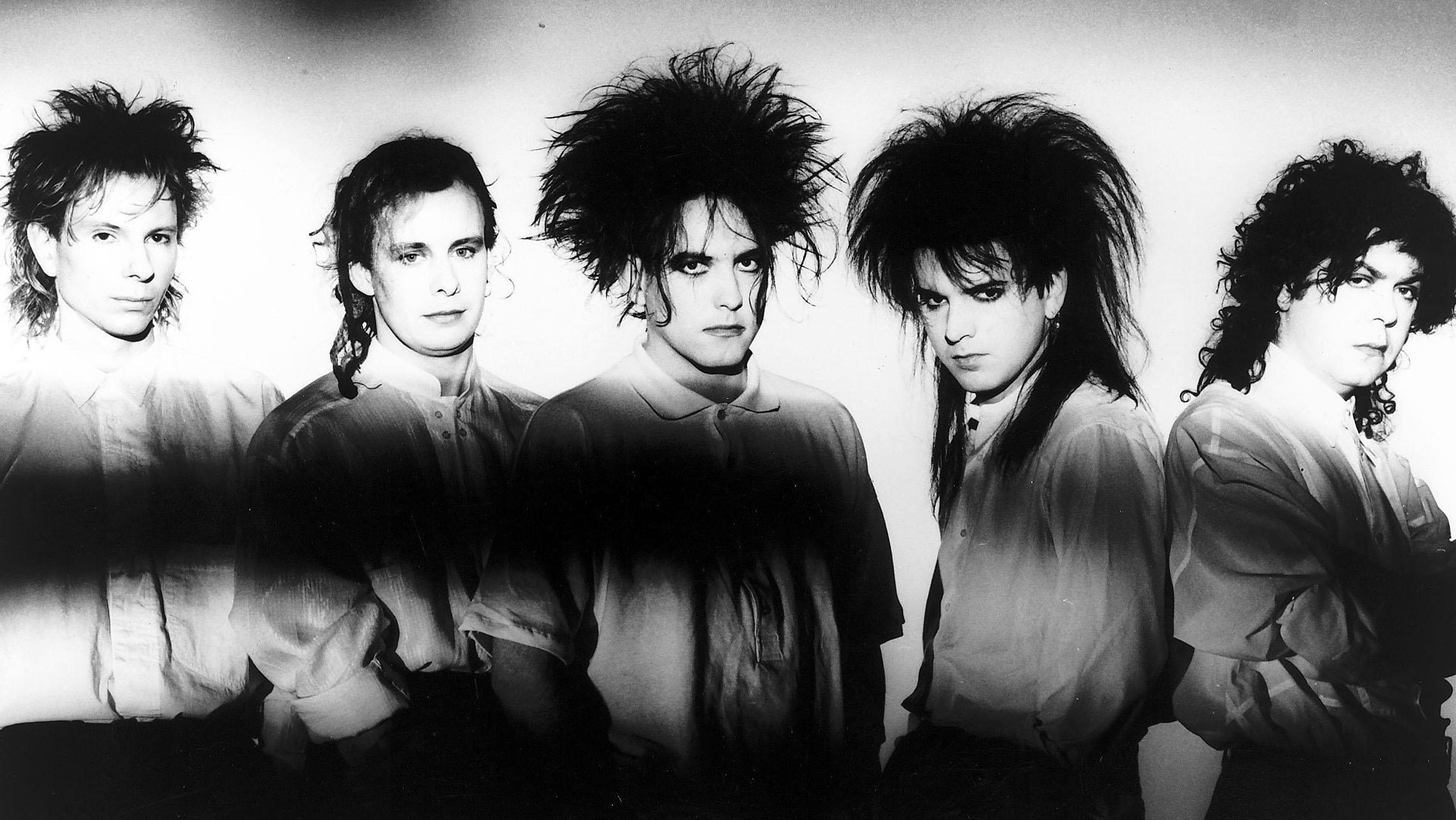 A black and white picture of The Cure from 1986 with Lol Tolhurst on the right